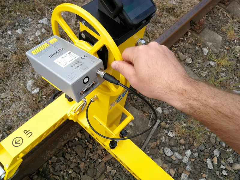 The DIMETIX laser distance meter connects with a single cable; it is the same laser offered as an add-on for the KRAB trolleys