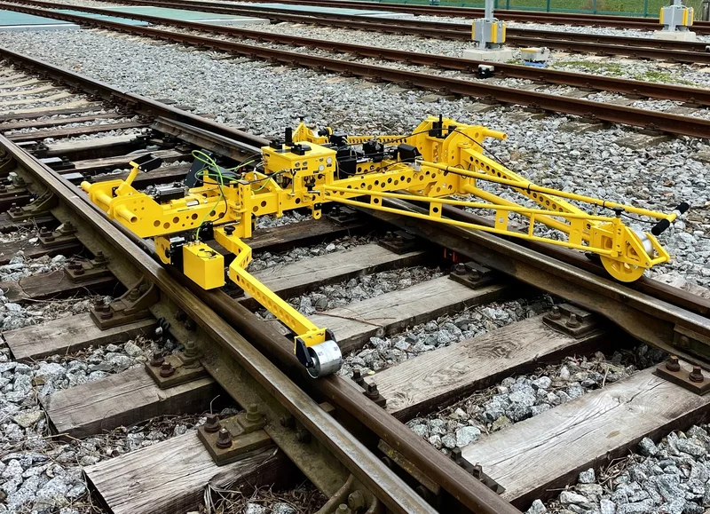 Standing in a switch: the frame is spread against both rails and measures through switches and crossings