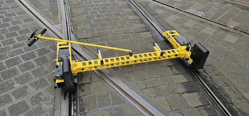 The tow bar folds to the side and the trolley separates into three parts for transport in a car