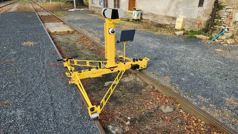 The same trolley in front of a station building, ready to be pushed at walking speed
